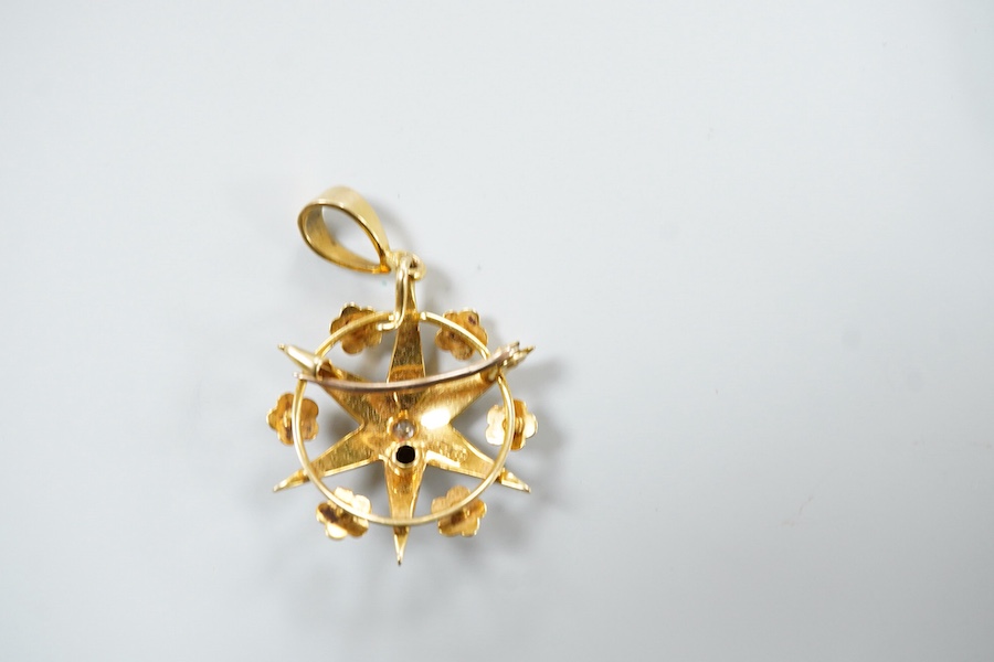 A Victorian yellow metal (stamped 18), diamond and graduated split pearl set star pendant brooch, makers mark SS, 39mm including the bale, gross weight 5.2 grams, with fitted box.